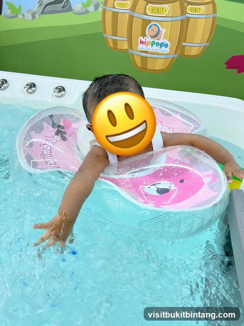 Baby in a pool with a float