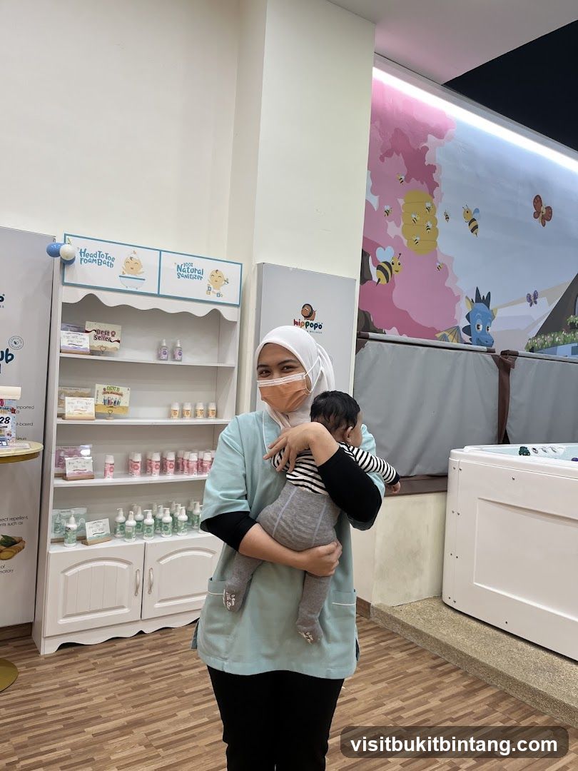Staff member holding a baby