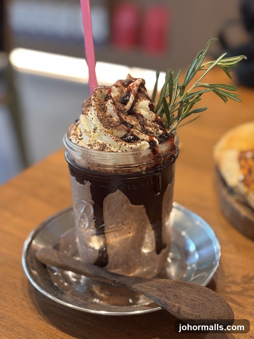 Chocolate Drink with Whipped Cream and Rosemary