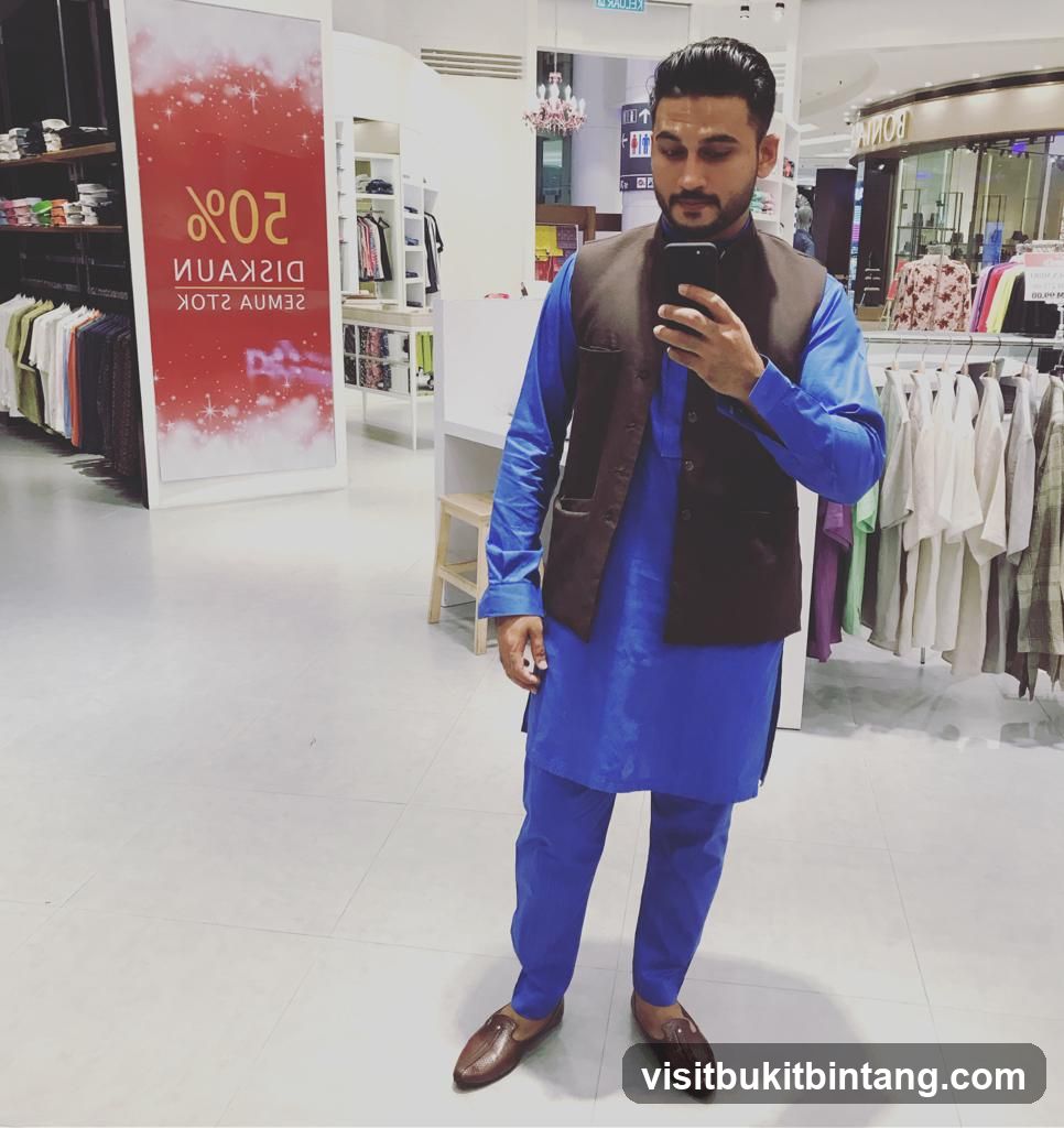 Man taking a selfie in a clothing store