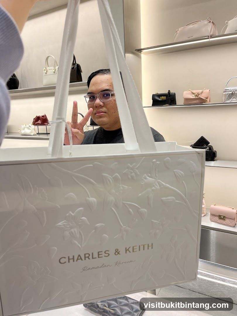 Person holding a shopping bag in a store