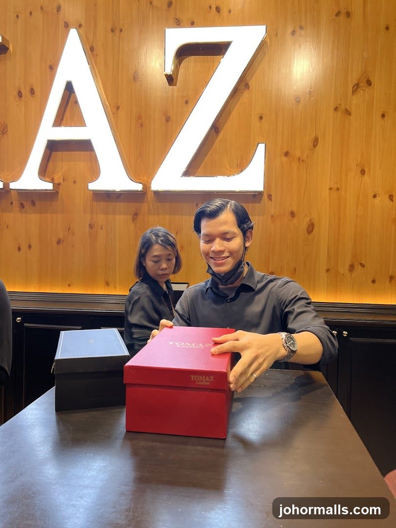 Man opening a red box