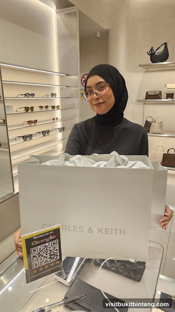Woman holding a Charles & Keith shopping bag