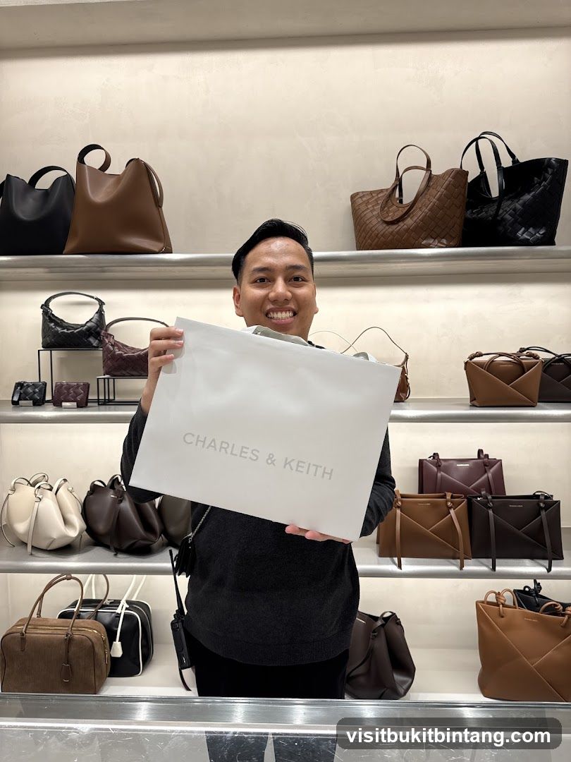 Man holding a Charles & Keith shopping bag