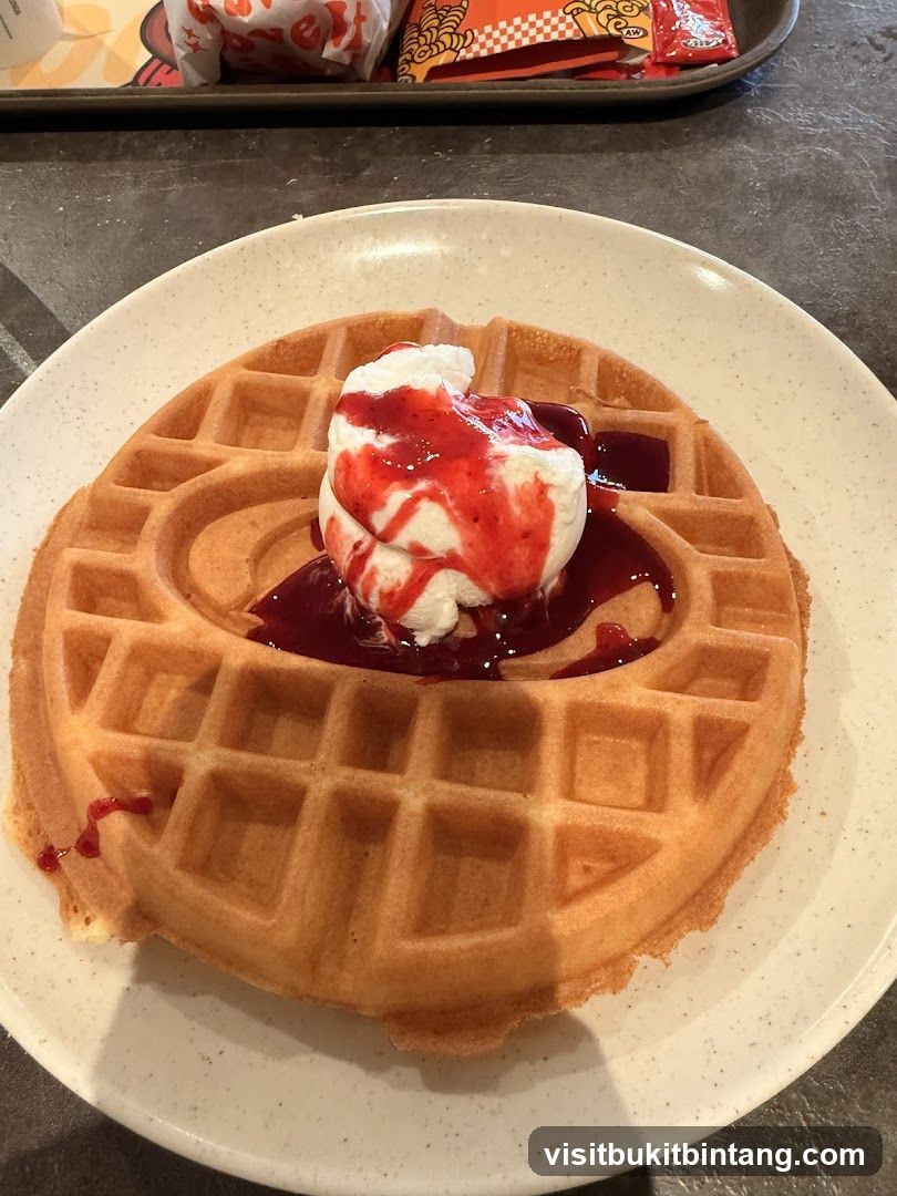 Waffle with Ice Cream and Berry Sauce