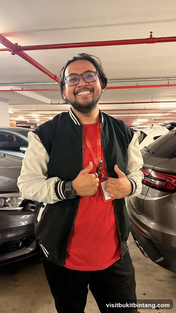 Man in bomber jacket giving thumbs up