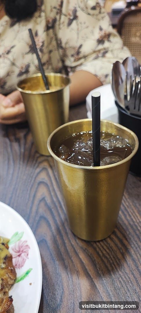 Two golden cups with drinks