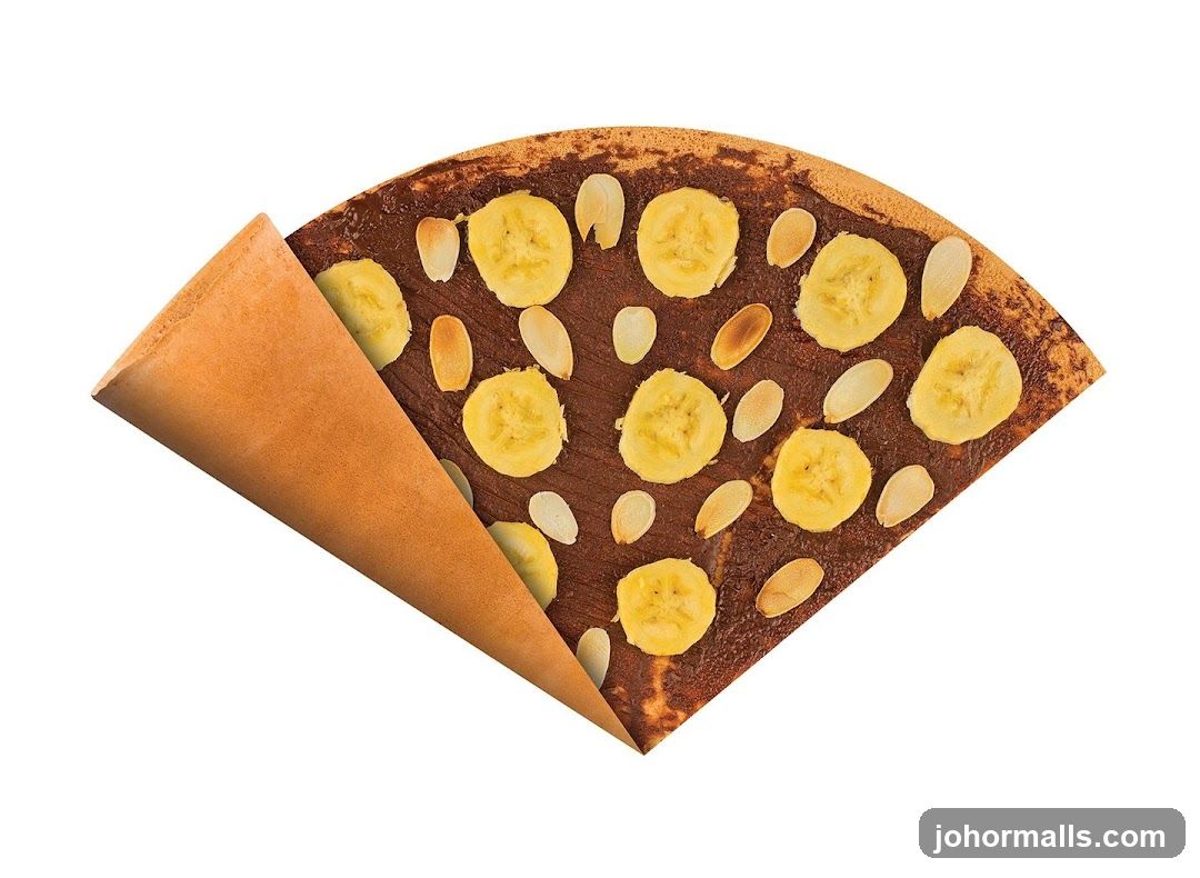 Crepe with Chocolate Spread, Banana Slices, and Almond Slivers