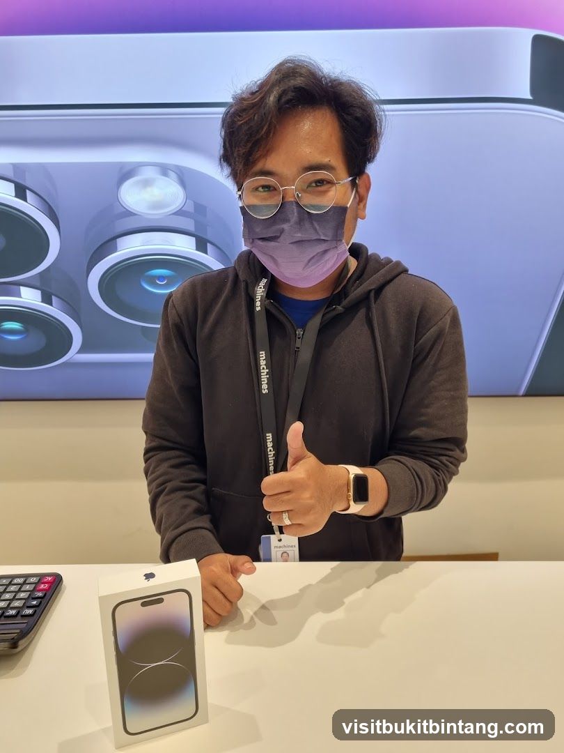 Man with iPhone box