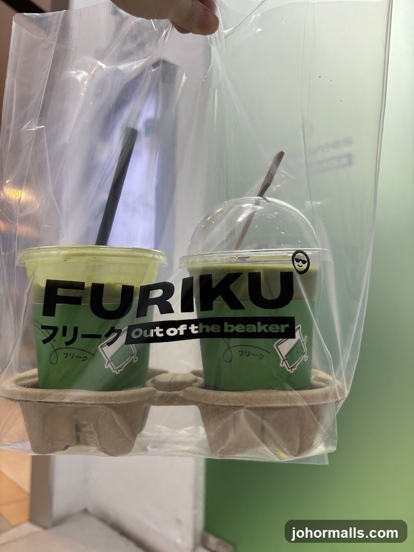 Two green drinks in a plastic bag