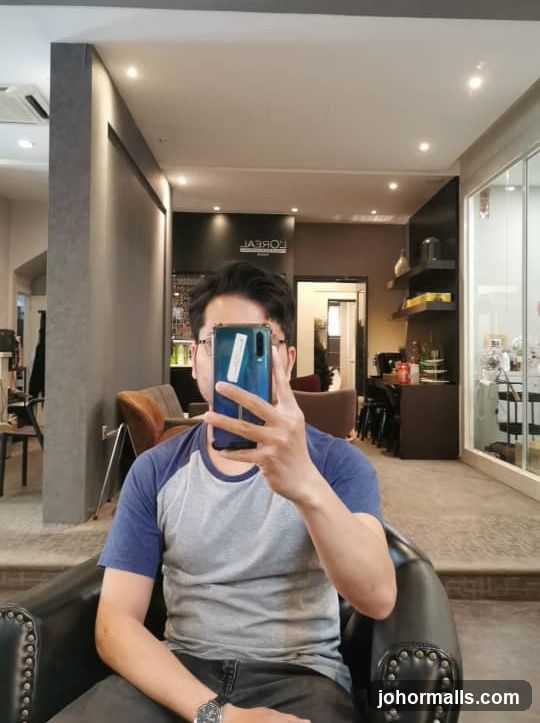 Man taking a selfie in a salon