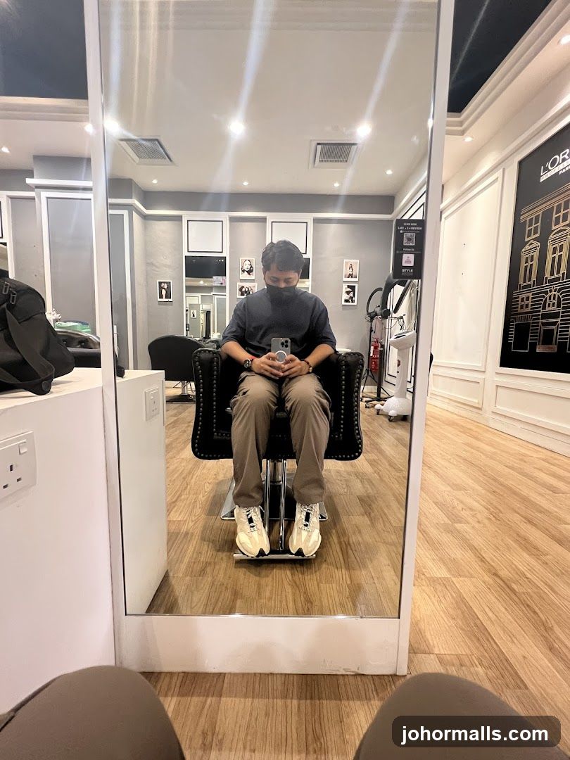 Man sitting in a salon chair