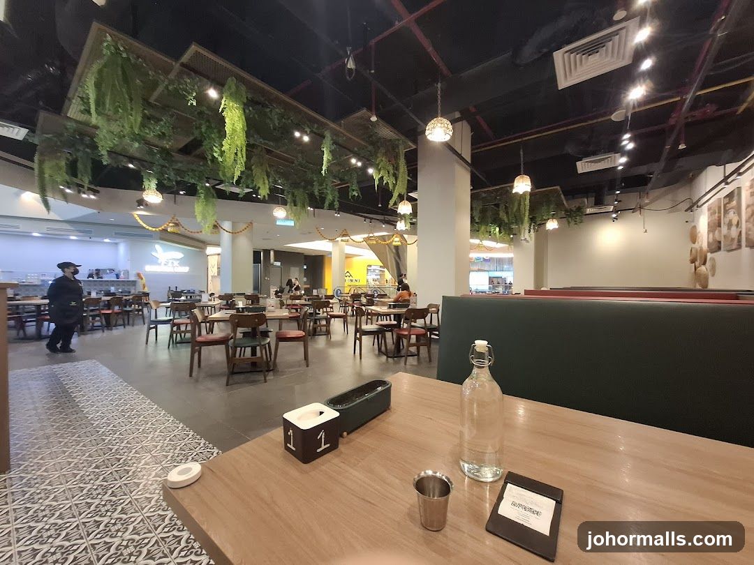 Restaurant Interior with Greenery and Booth Seating