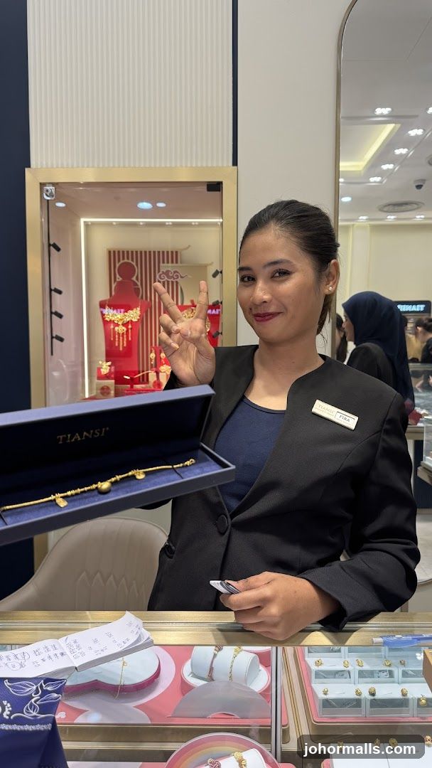 Jewelry Store Employee Showing Bracelet