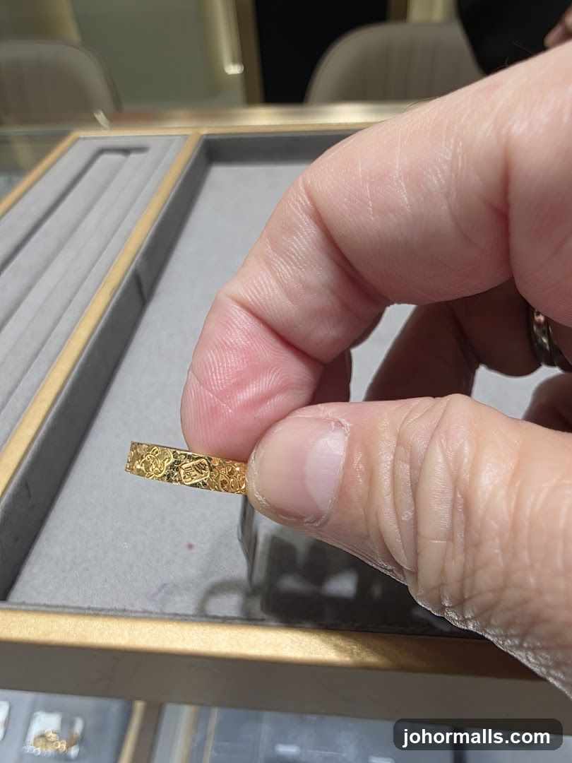 Close-up of a gold ring with intricate patterns