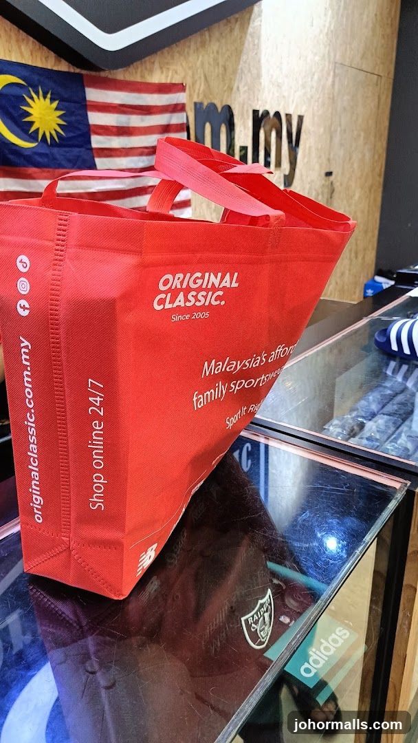 Red shopping bag with store branding