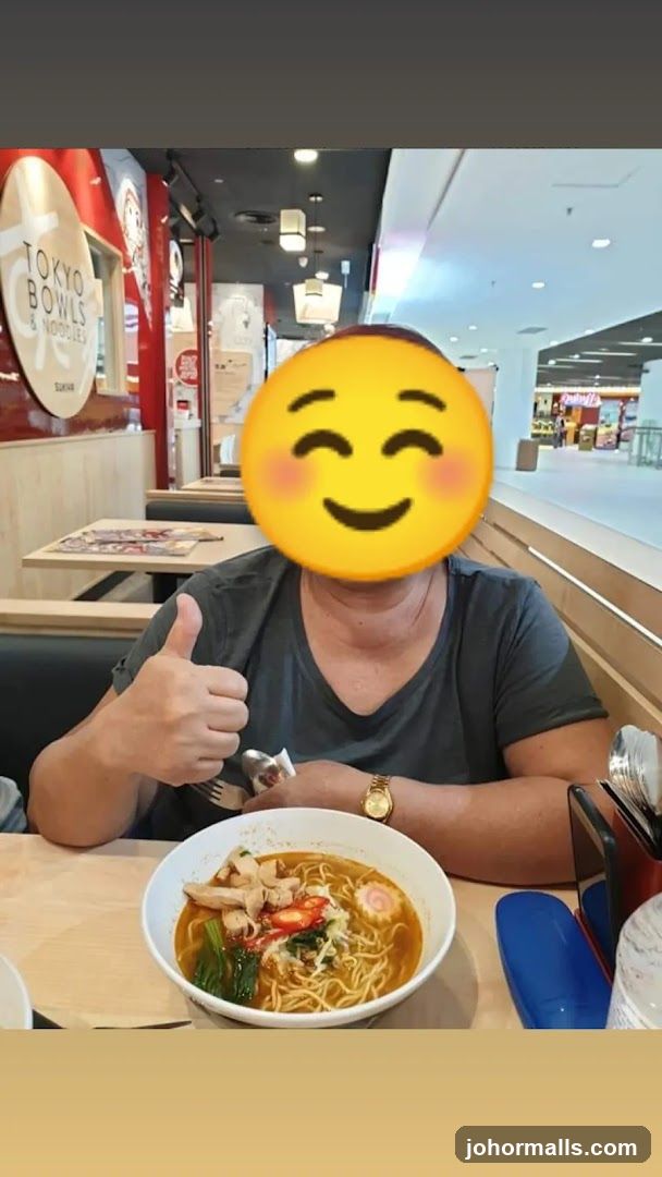Person eating ramen