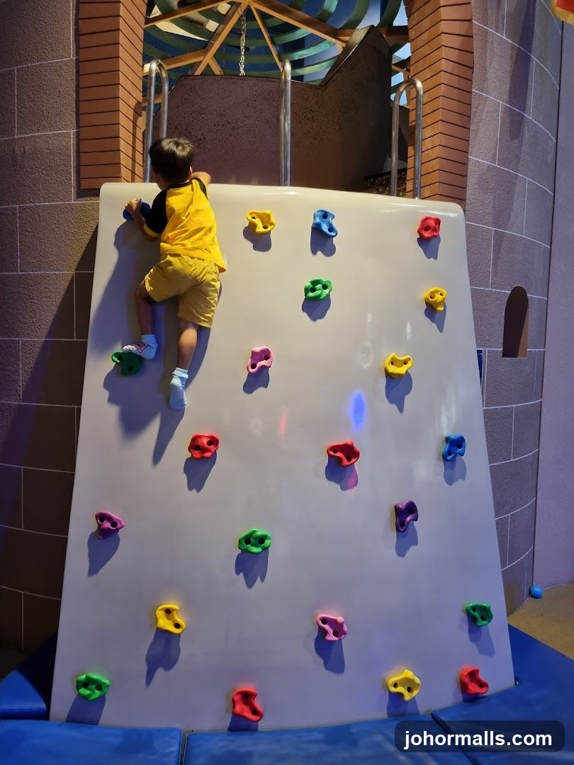Child climbing a rock wall