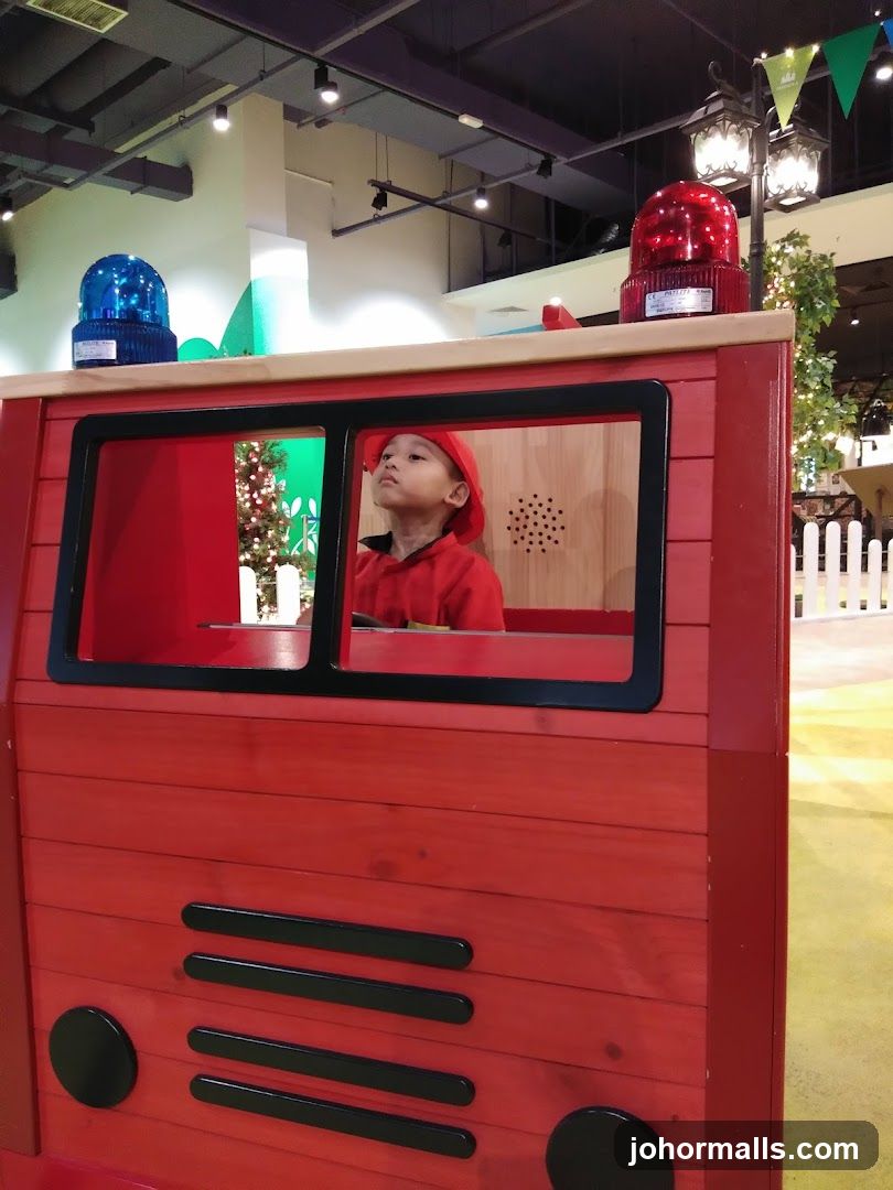 Child in Fire Truck Play Structure