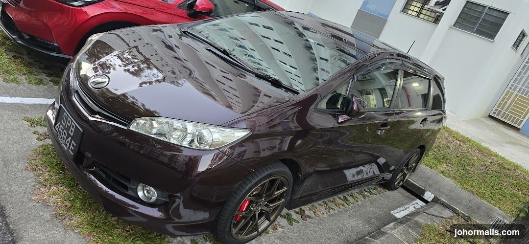 Maroon car parked next to a red car