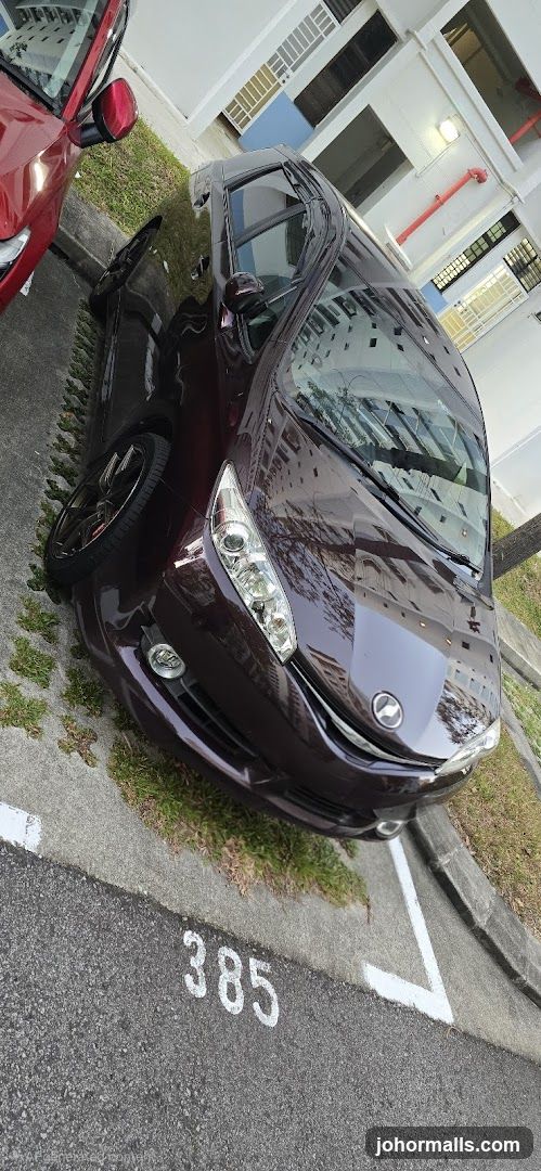 Dark Red Car Parked in Lot