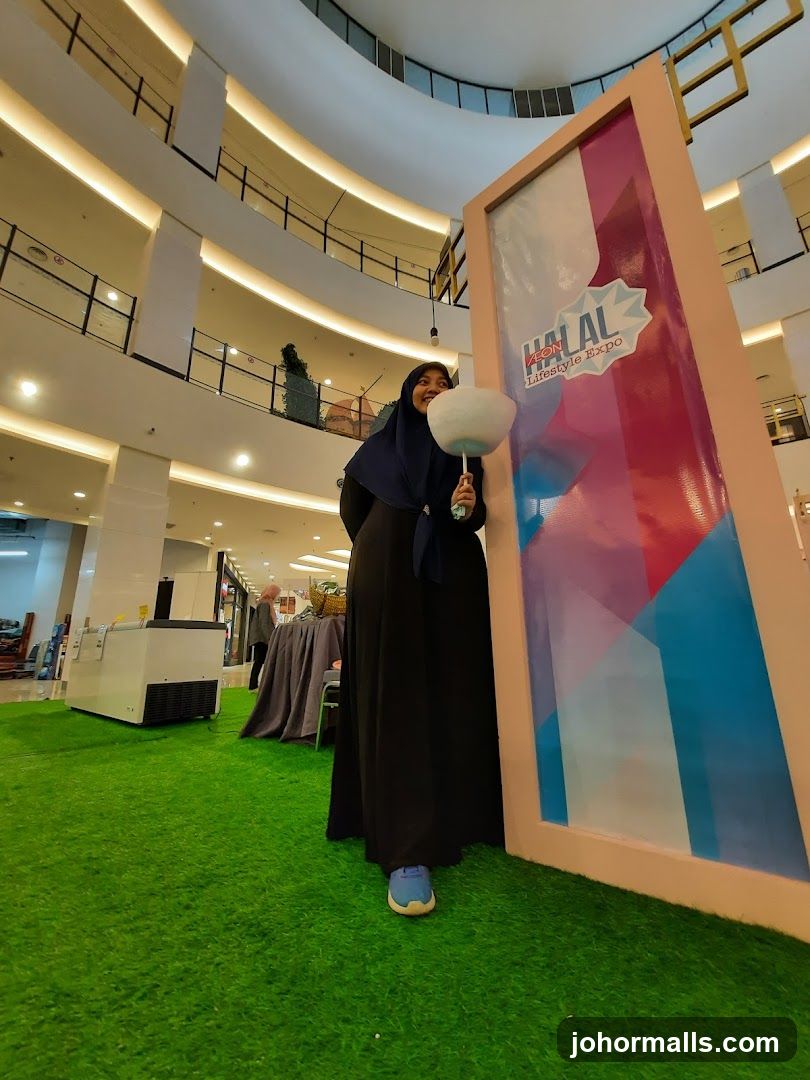 Woman holding cotton candy at Halal Lifestyle Expo