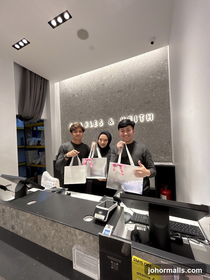 Employees holding shopping bags