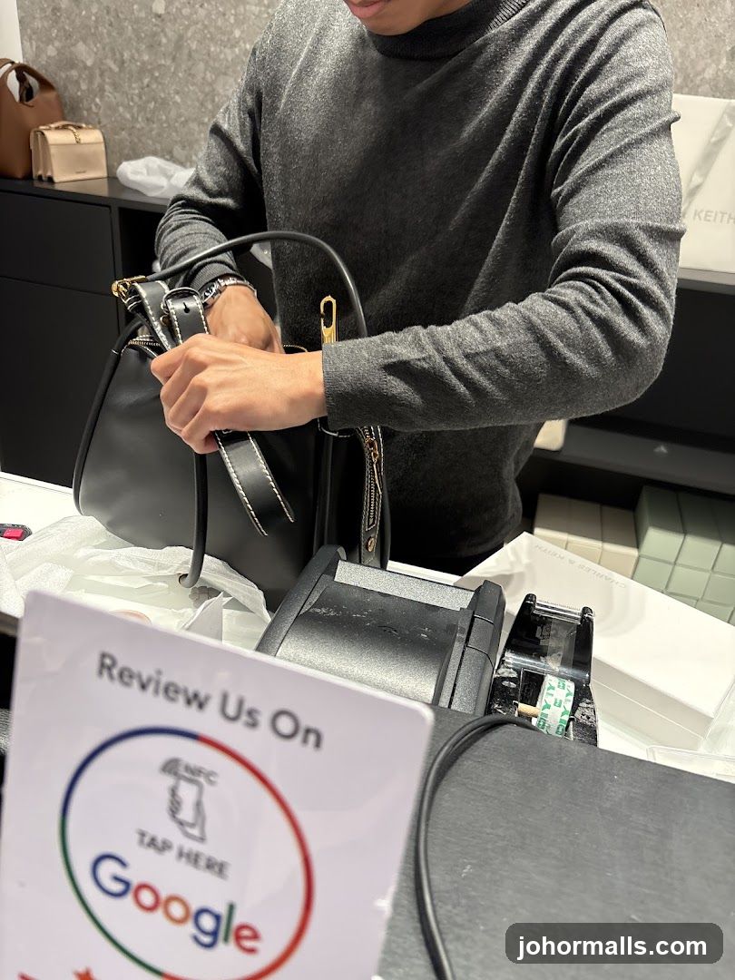 Customer reviewing a handbag at a checkout counter