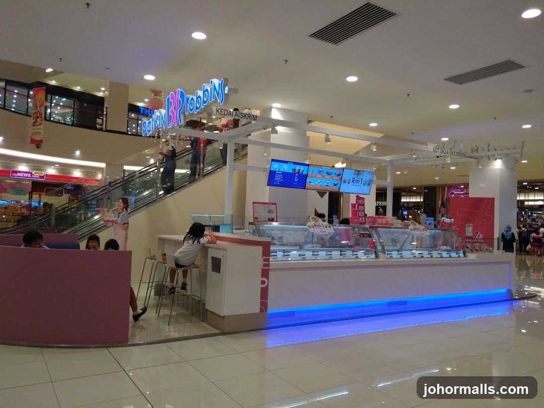 Inside a shopping mall with an ice cream stall