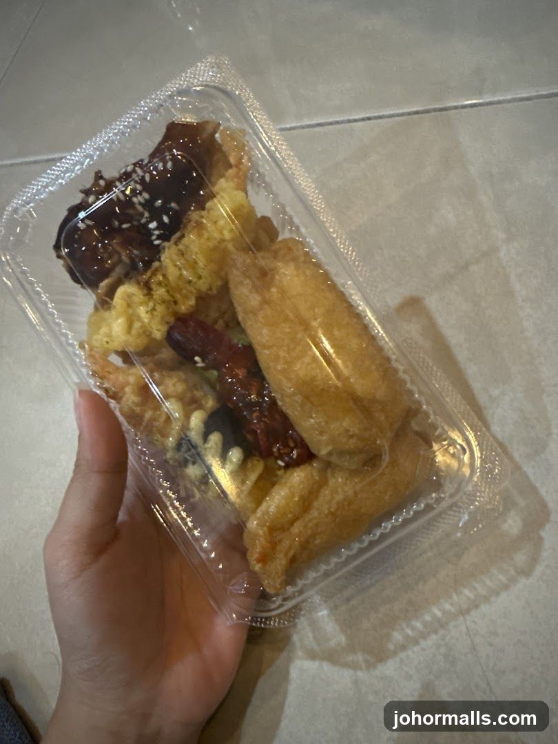 Hand holding food container