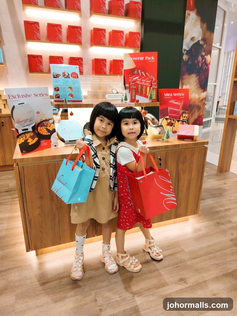 Two young girls holding shopping bags in a store