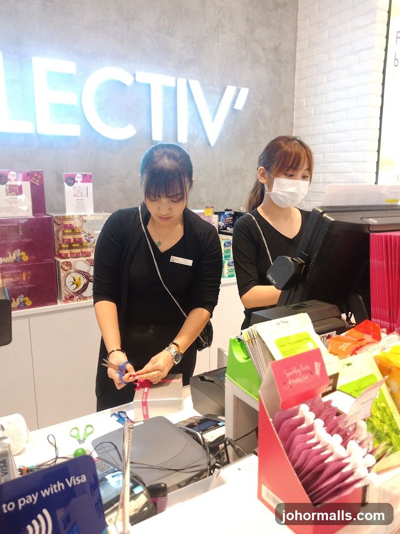 Staff wrapping a gift at a counter