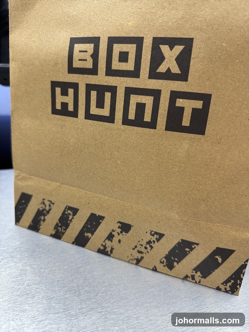 Brown paper bag with "BOX HUNT" logo