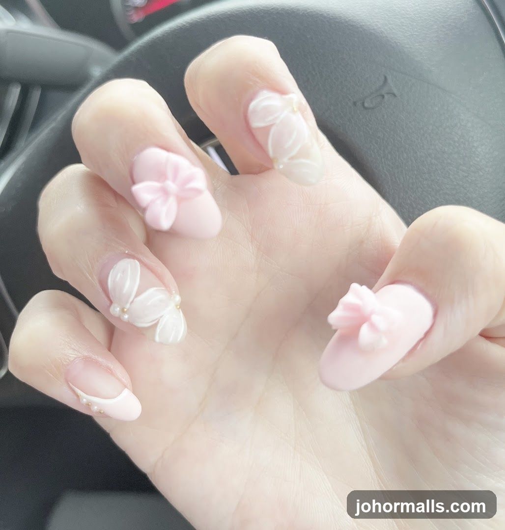 Pink Nails with Floral and Bow Embellishments