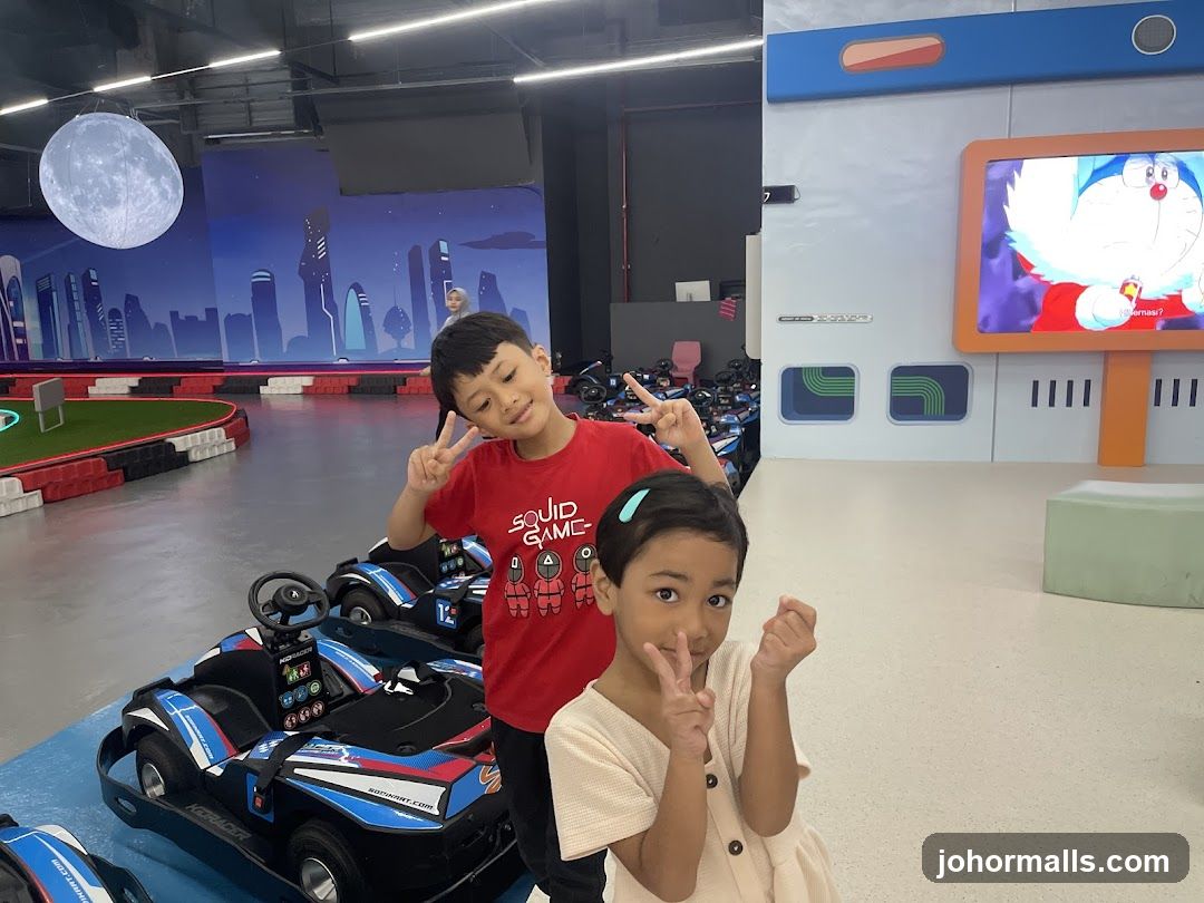Children posing at a go-kart track