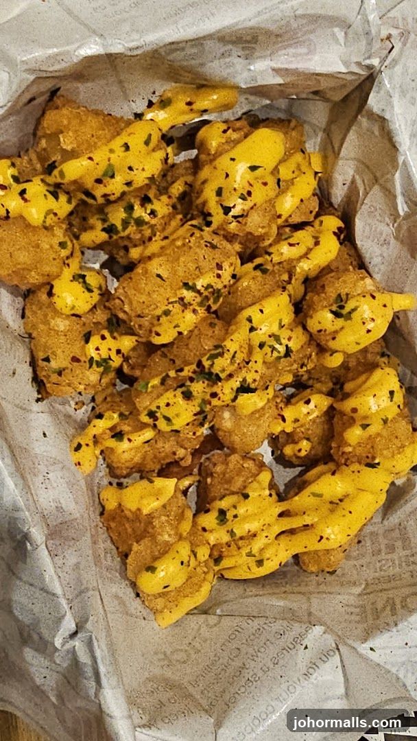 Cheese-drizzled fried food