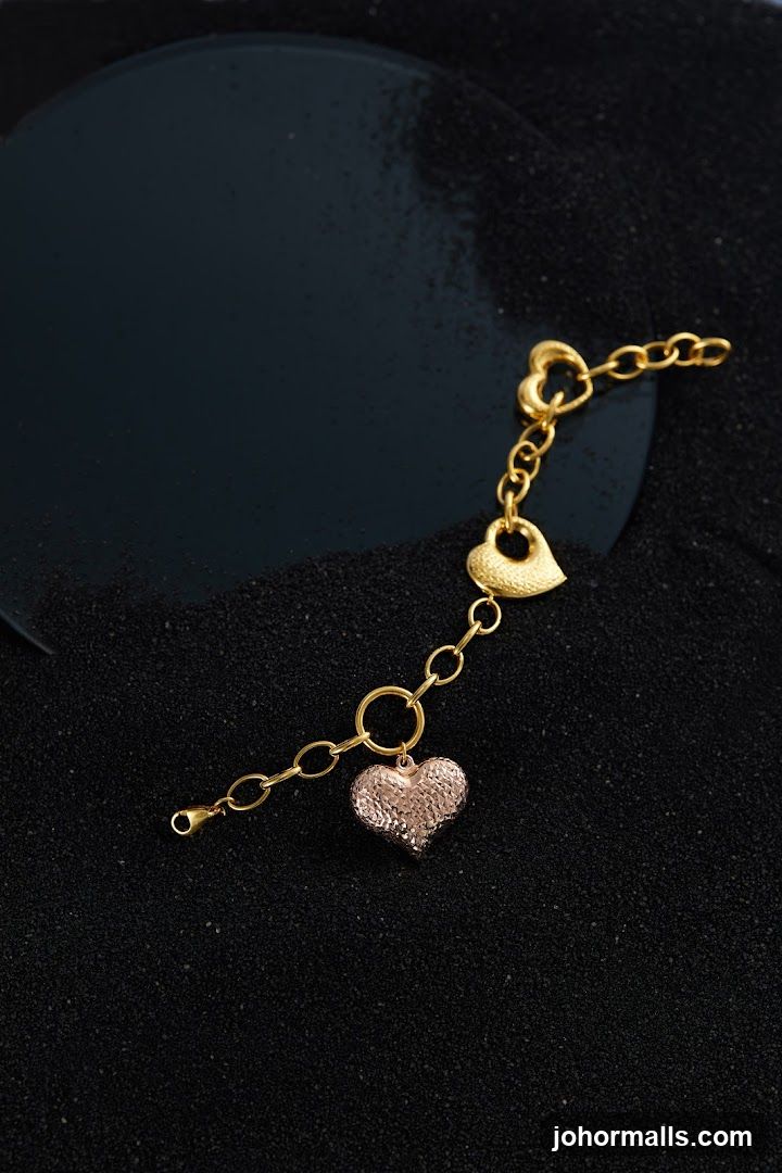 Gold bracelet with heart charms
