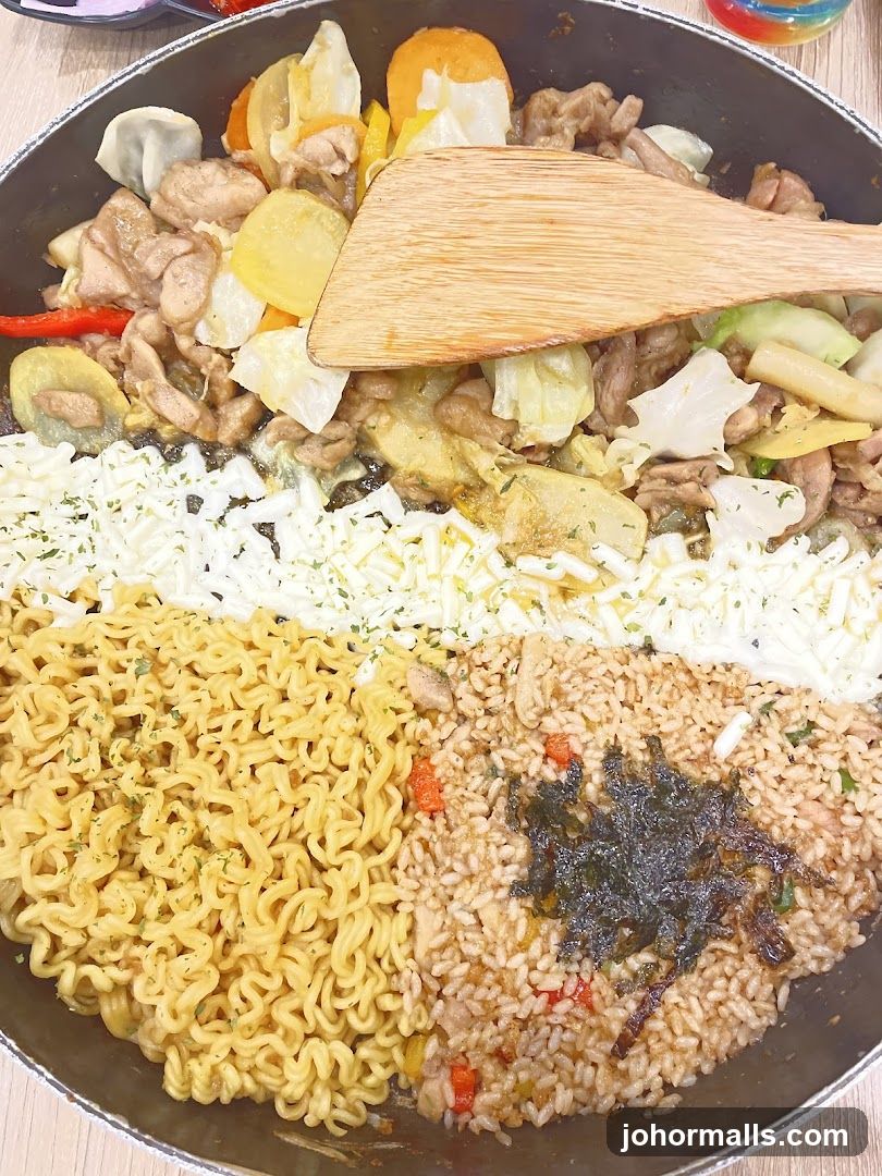 Stir-fried dish with noodles, rice, and cheese