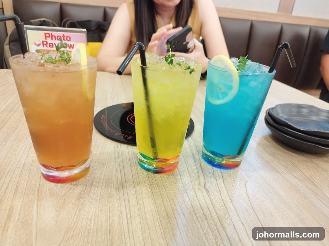 Three colorful drinks on a table