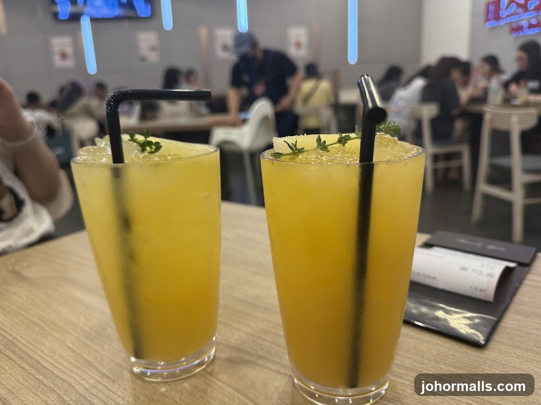 Two yellow drinks on a table