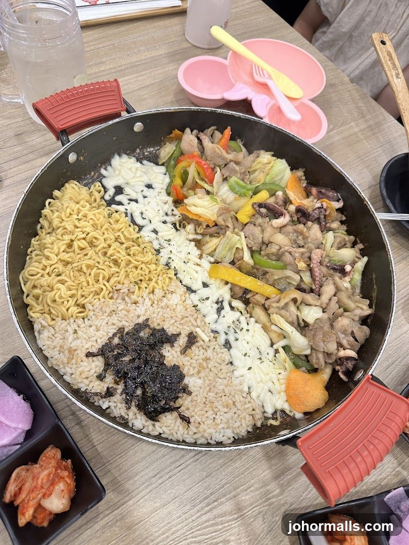 Stir-fried dish with noodles, rice, and vegetables