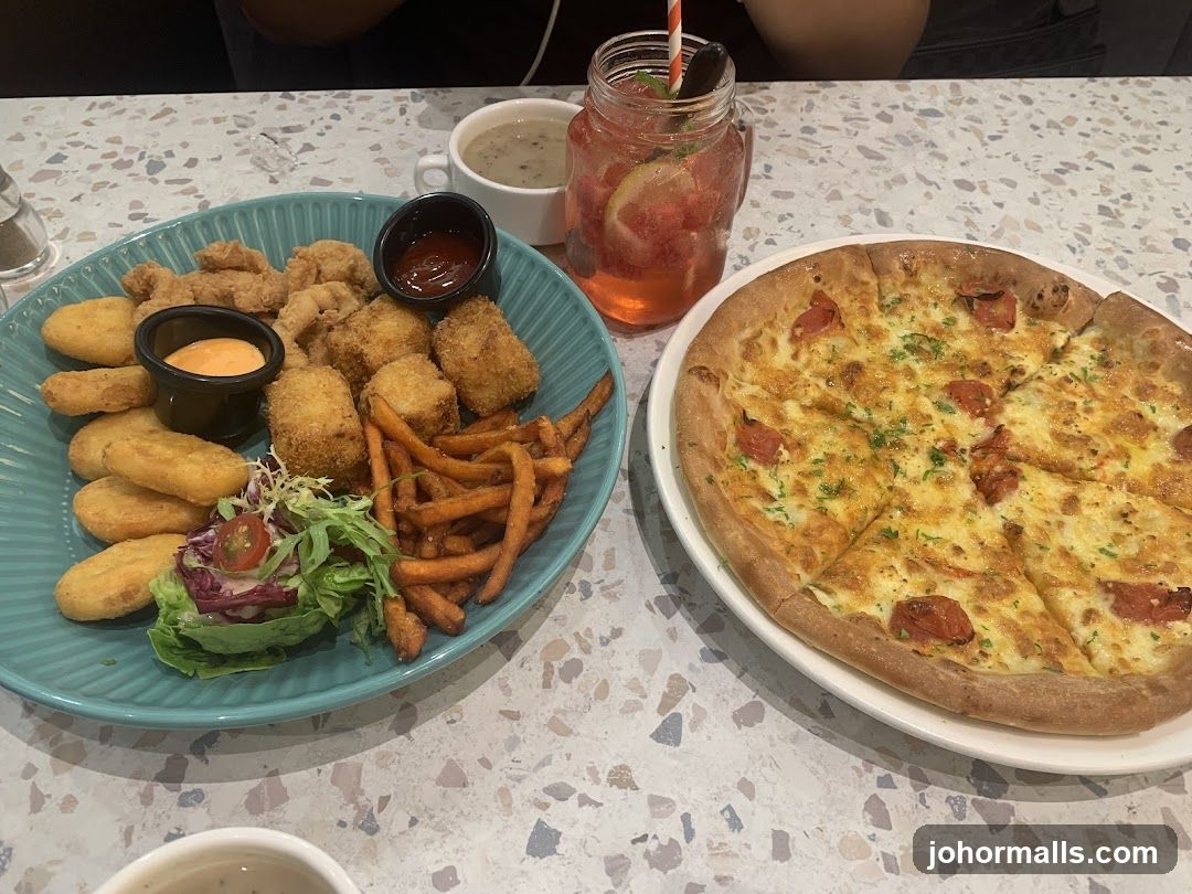 Platter of fried food and pizza