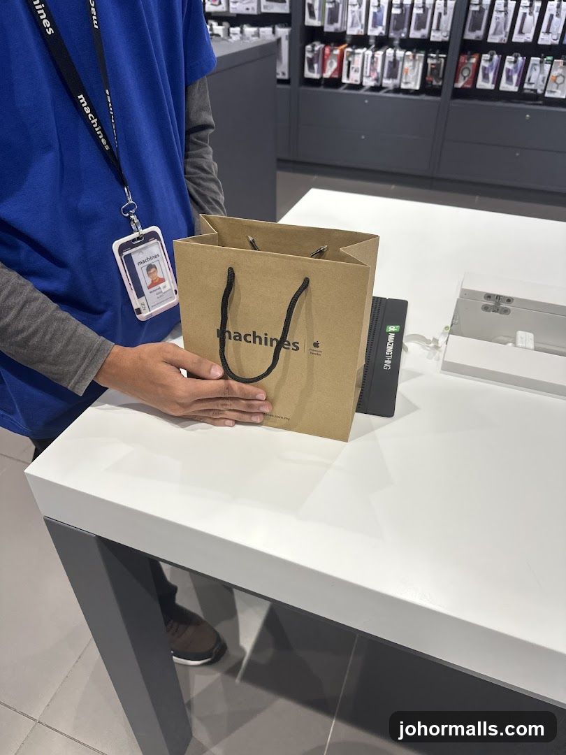 Employee holding a shopping bag