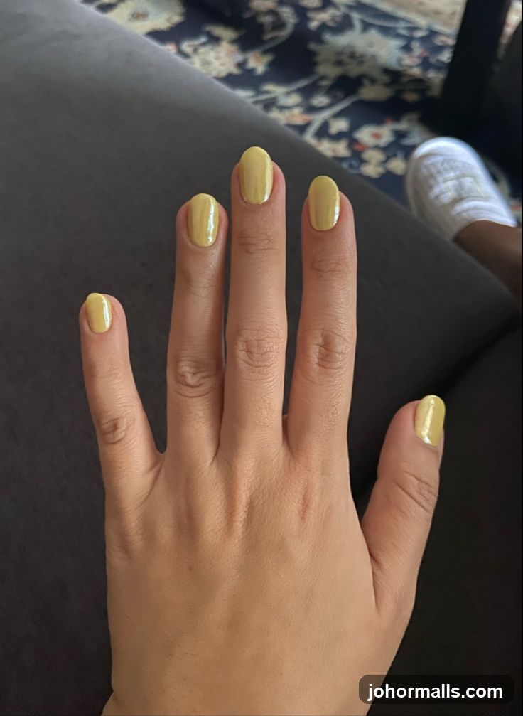 Hand with Yellow Nail Polish