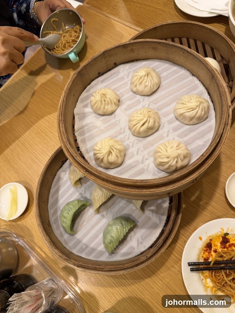 Dumplings and Noodles at a Restaurant Table