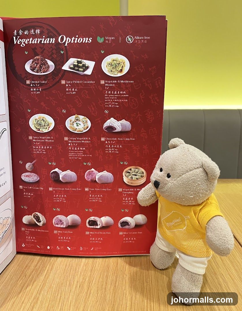 Stuffed bear beside vegetarian menu
