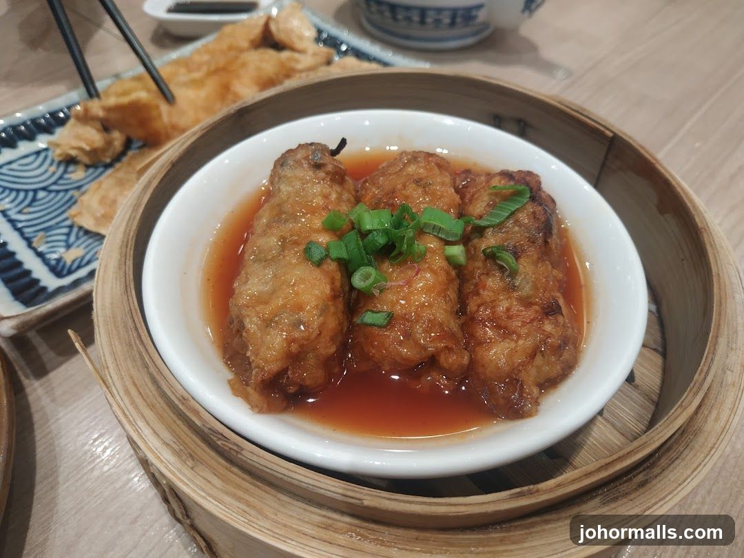 Dumplings in Sauce with Green Onions