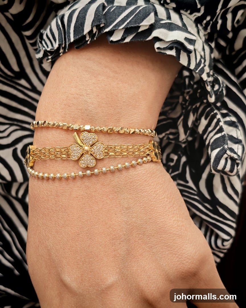 Hand wearing gold bracelets