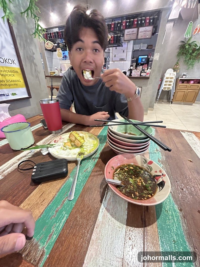 Person Eating at a Restaurant Interior