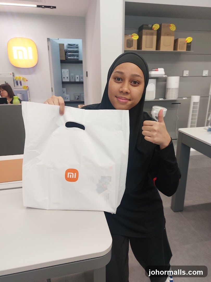 Woman holding a shopping bag in a store